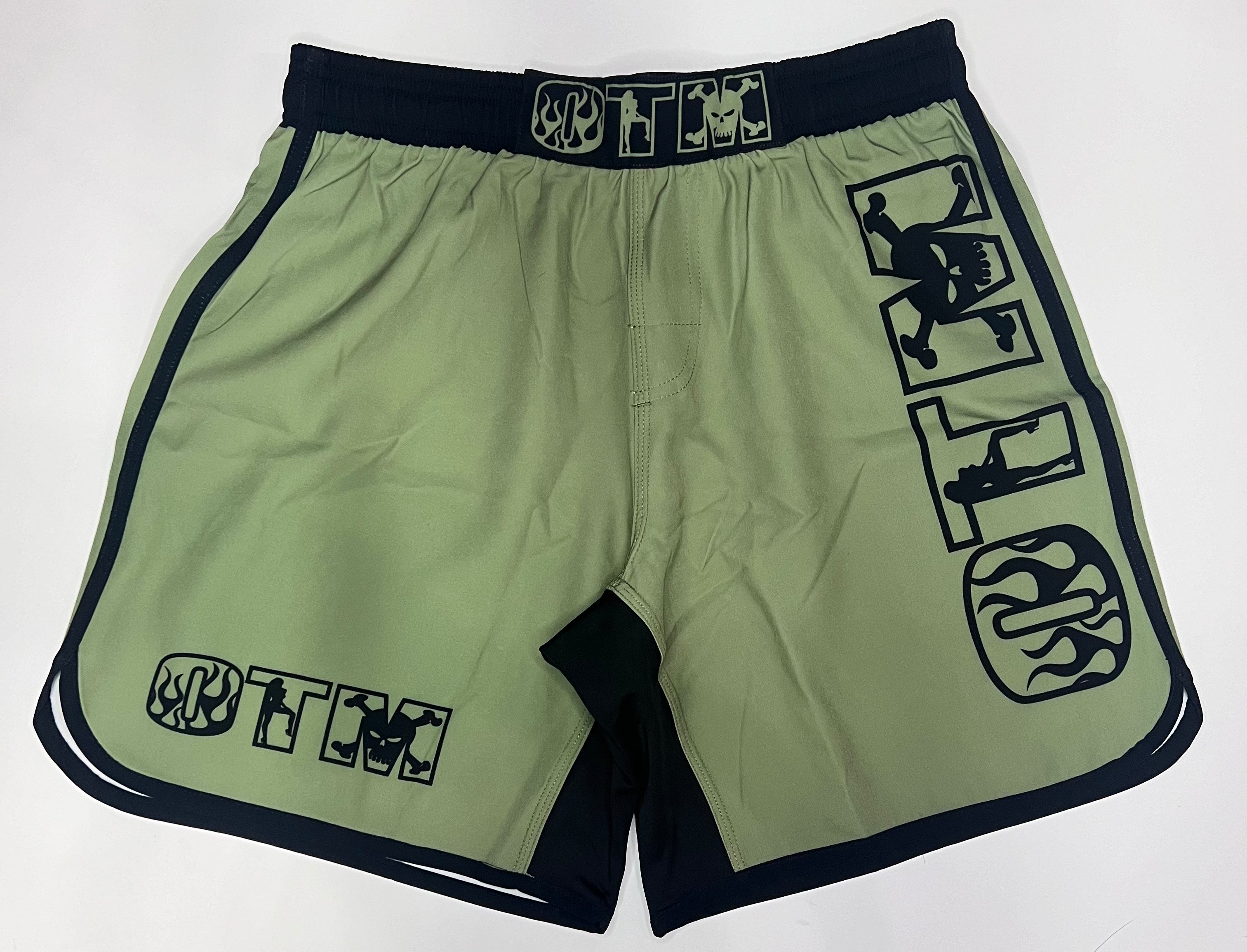 OTM FHS Fight Shorts green design with OTM branding, professional-grade grappling and training shorts