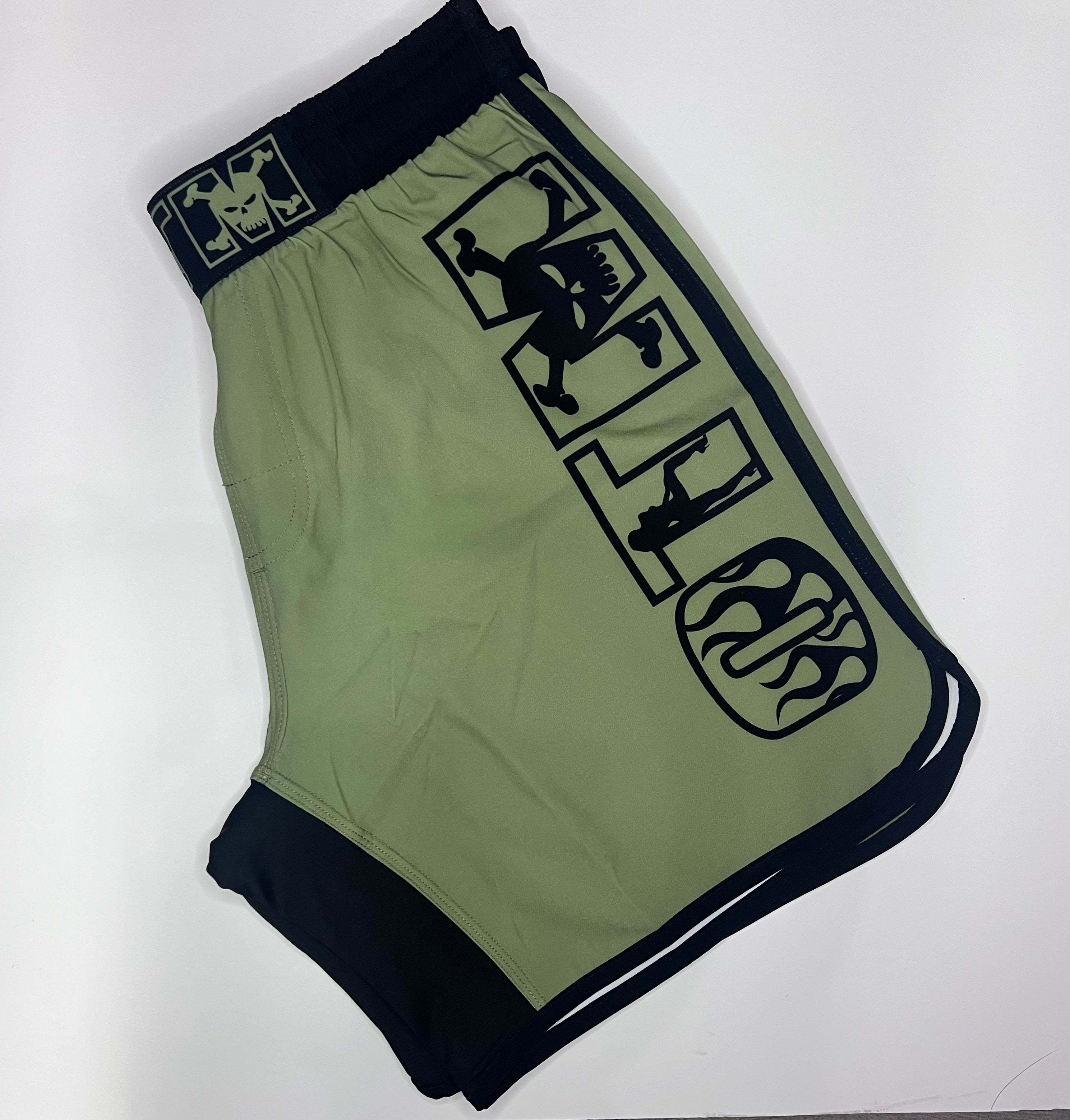 OTM FHS Fight Shorts in green with black trim, lightweight 4-way stretch fabric for MMA and BJJ
