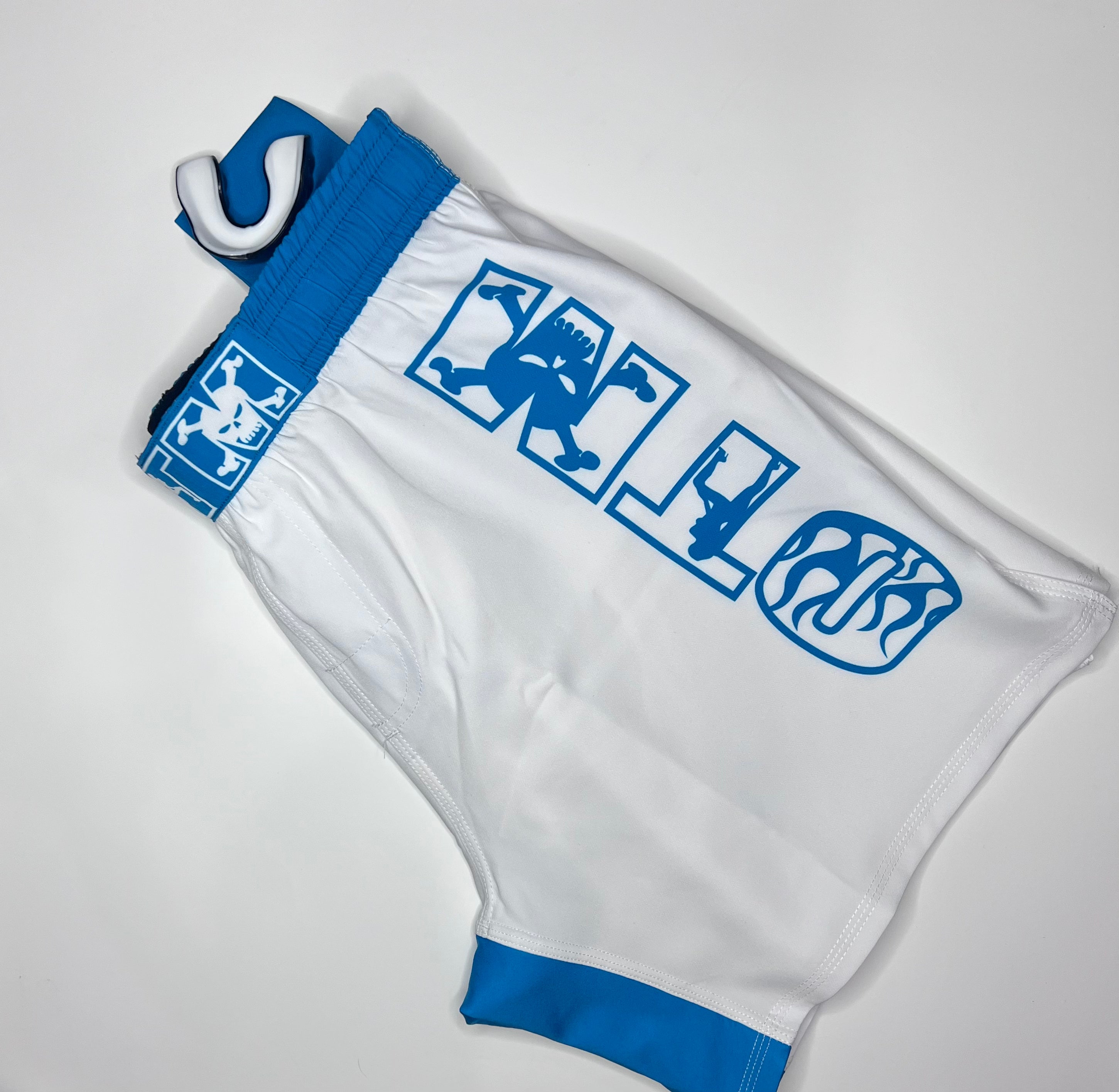 OTM FHS Fight Shorts white and blue edition, designed for MMA, BJJ, and kickboxing with reinforced seams